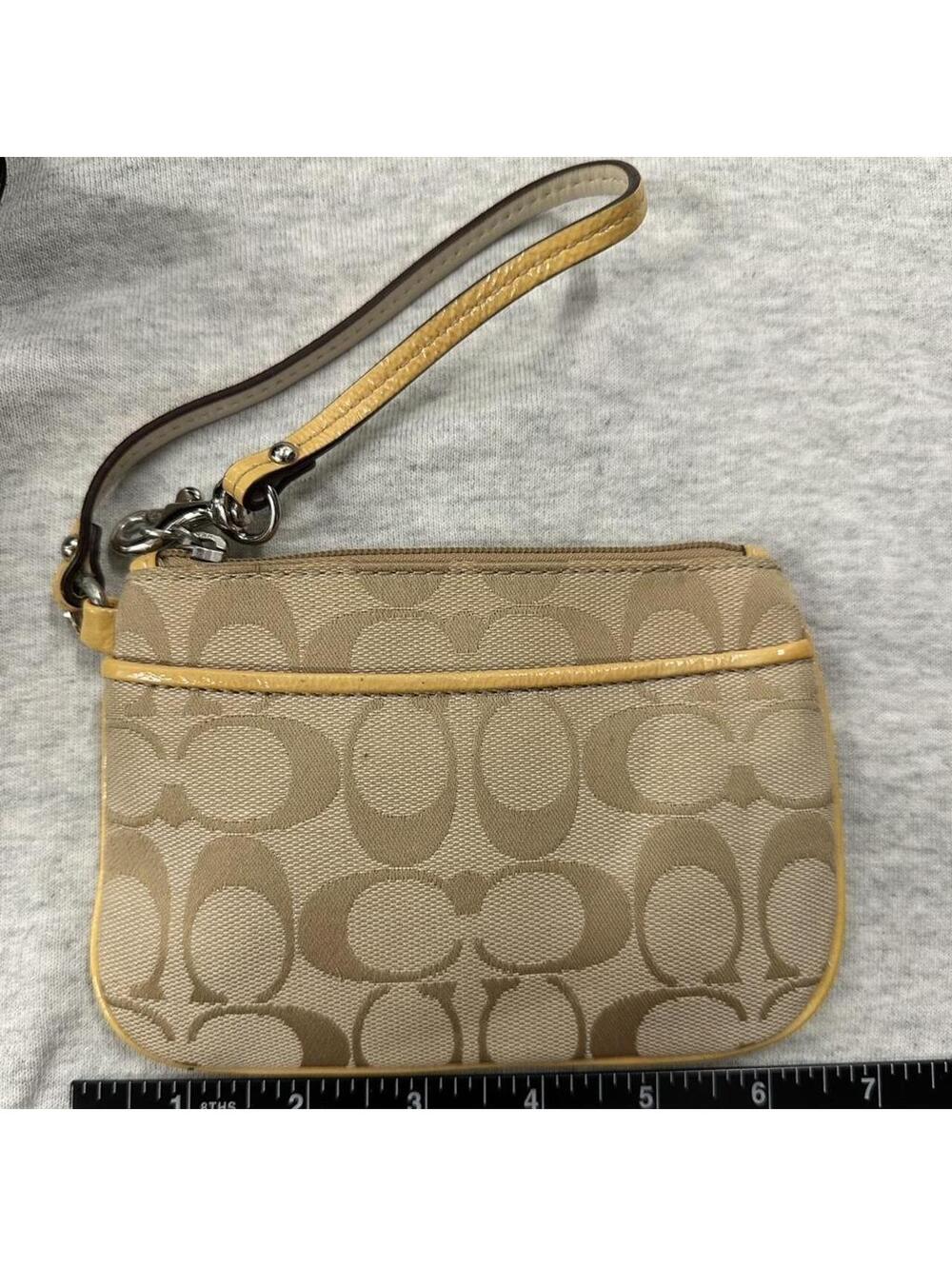 Y2k vintage Tan and yellow Coach wristlet with zipper closure and leather trim